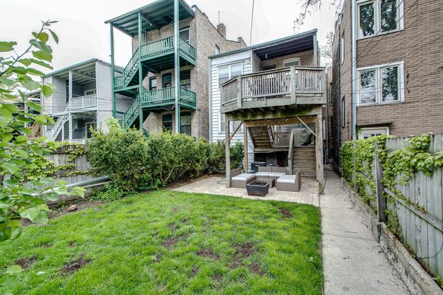 a front view of a house with garden and porch