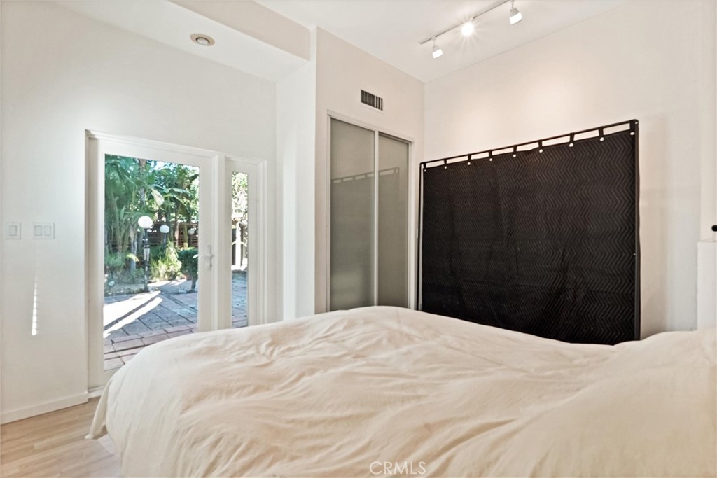 22037 Ybarra Road Woodland Hills, CA 91364 - Photo 24 of 32 a bedroom with a bed and a dresser