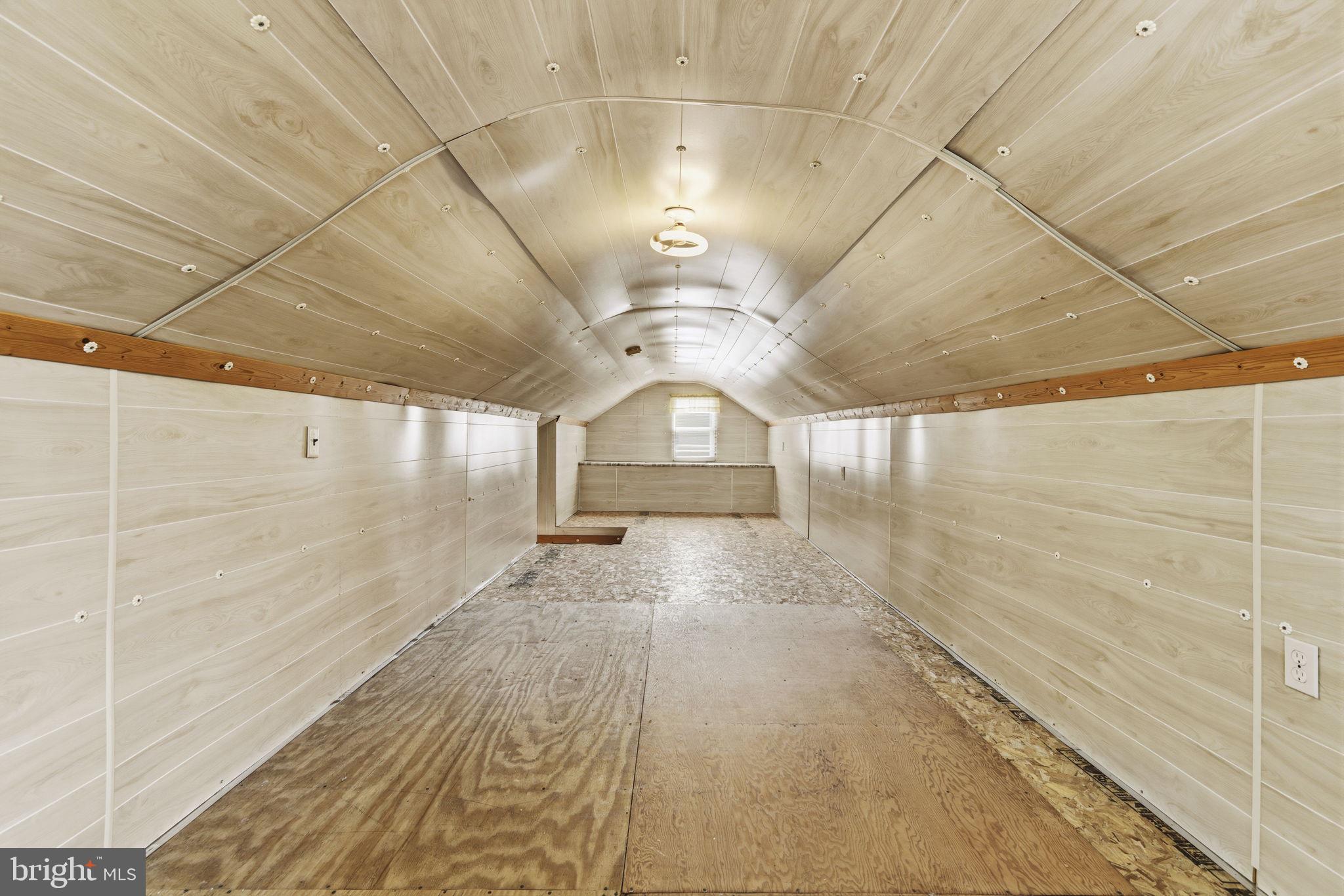 2411 Poplar Road Baltimore, MD 21221 - Photo 24 of 36 a view of a hallway with wooden floor
