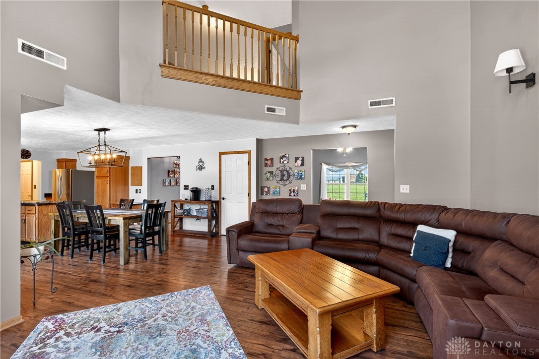 6560 Snyder Road Fletcher, OH 45326 - Photo 15 of 71 This inviting interior features high ceilings, hardwood flooring, and a seamless flow between living and dining areas.