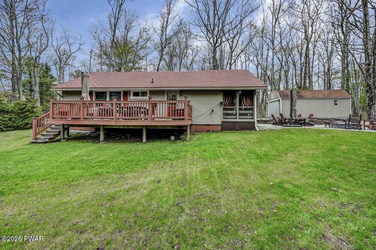 103 Forest Drive Hawley, PA 18428 - Photo 4 of 85 a view of a house with a big yard and large trees