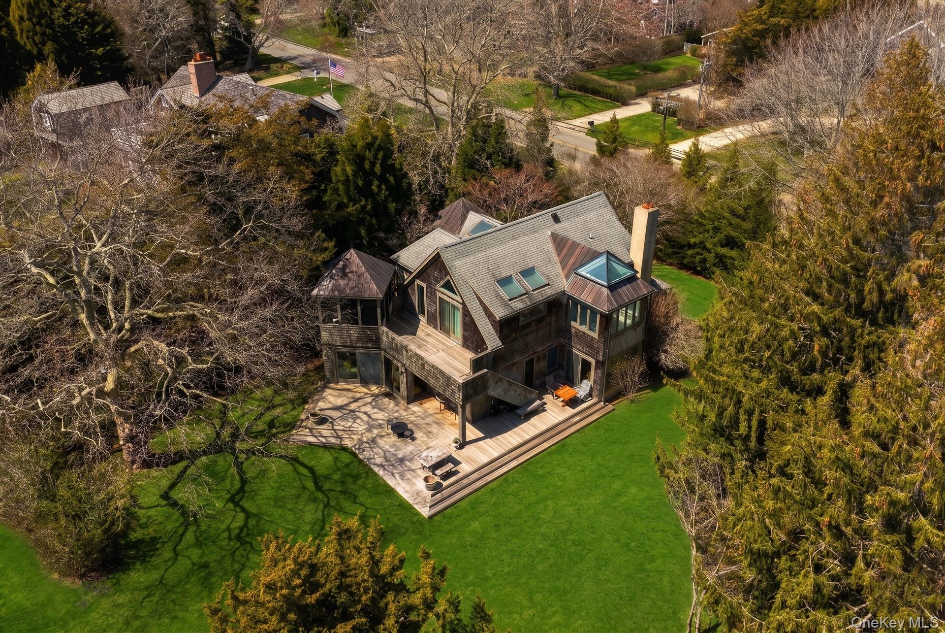 60 Skimhampton Road East Hampton, NY 11937 - Photo 31 of 37 a view of a house with a yard