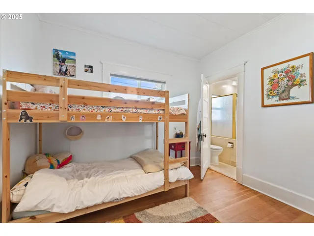 a bedroom with a bed and a table