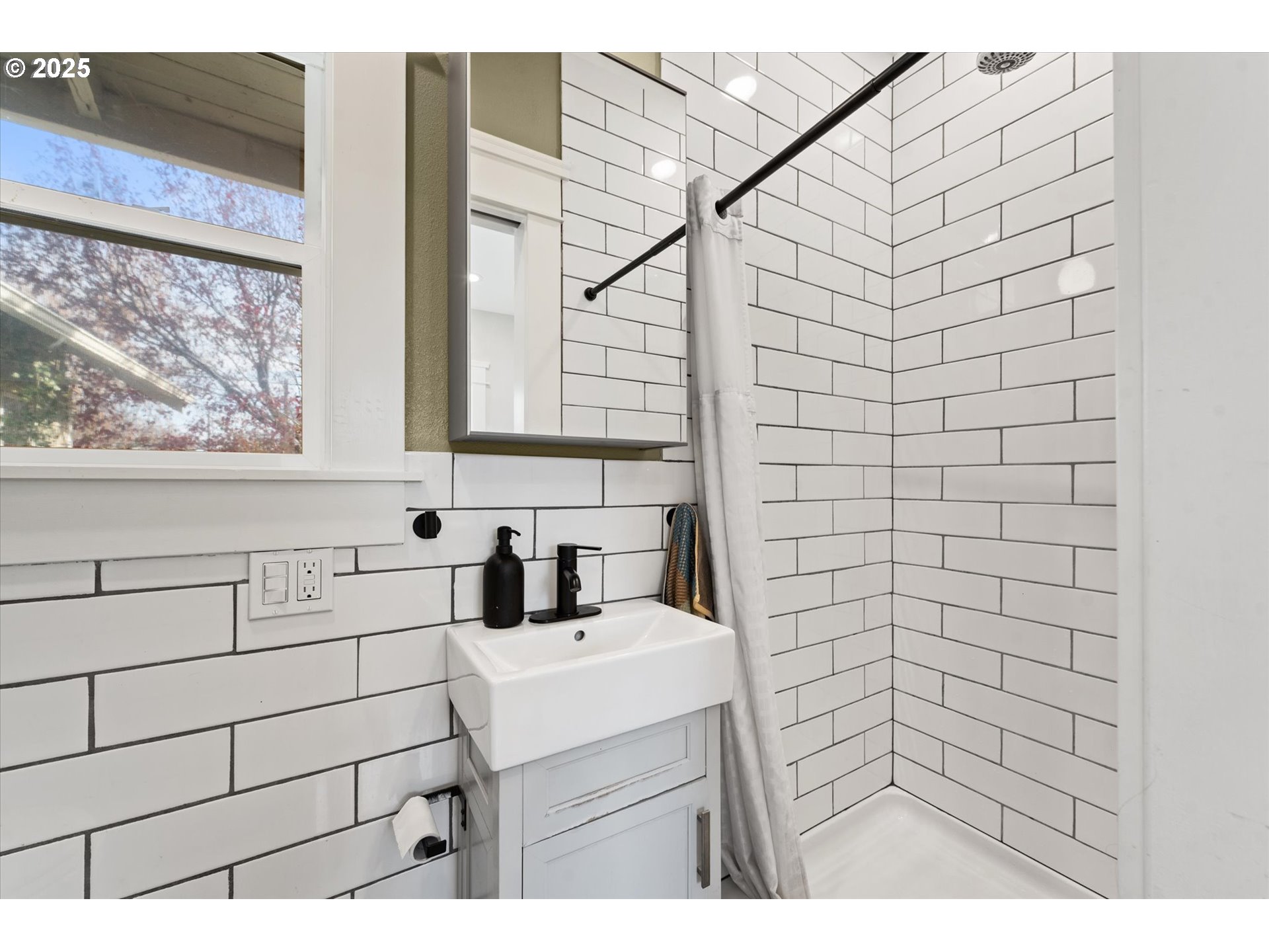2819 College Street Baker City, OR 97814 - Photo 28 of 47 a bathroom with a sink and a shower