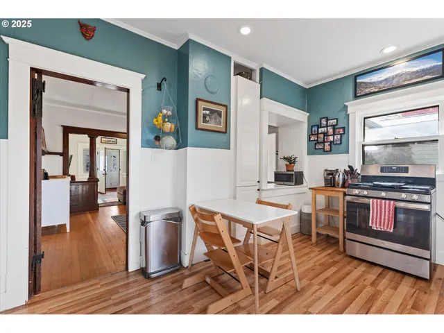 a open kitchen with a sink and a stove top oven