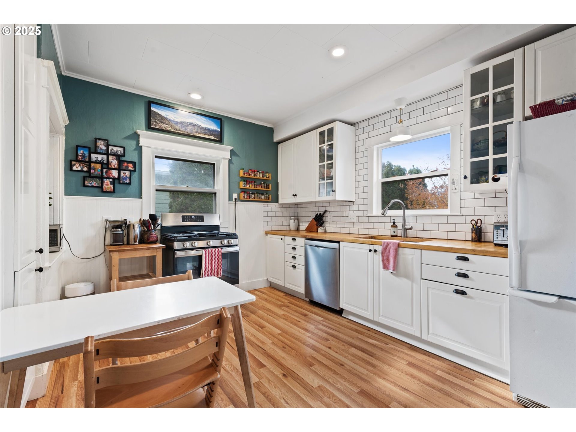 2819 College Street Baker City, OR 97814 - Photo 30 of 47 a kitchen with stainless steel appliances kitchen island granite countertop a sink counter space and cabinets