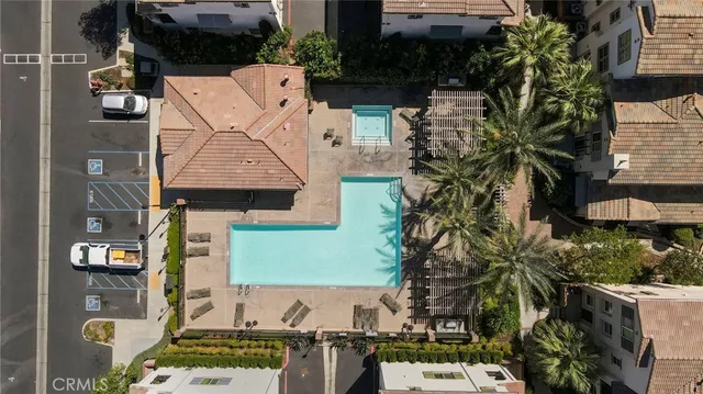 an aerial view of multiple houses with outdoor space