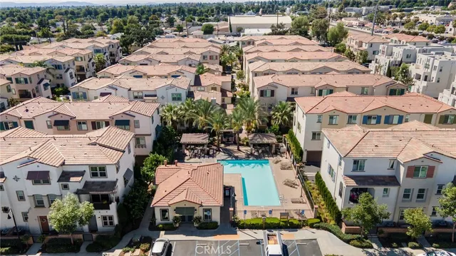an aerial view of residential houses with outdoor space