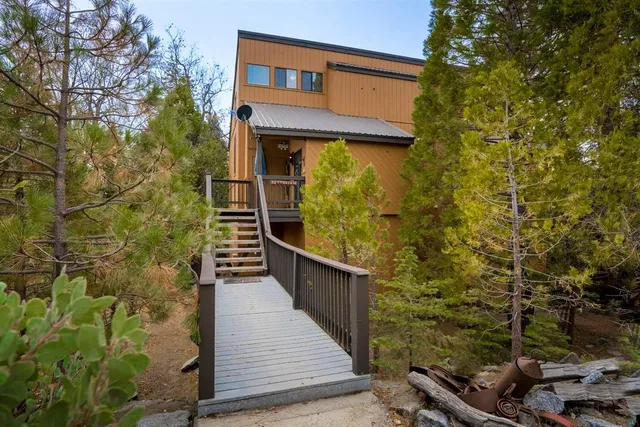 a balcony with next to a brick wall