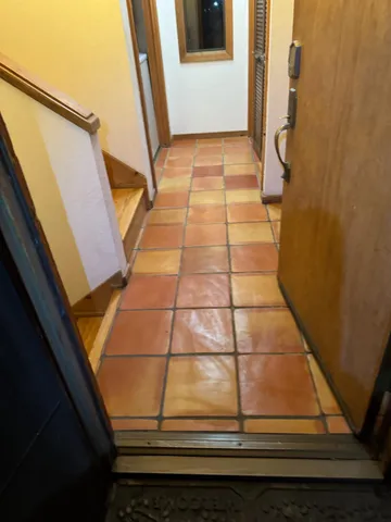 a living room with chairs and a table