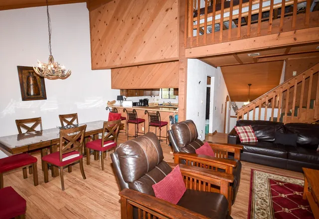 a view of a dining room with many windows