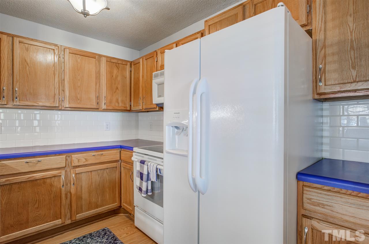 4641 Timbermill Court, Unit 201 Raleigh, NC 27612 - Photo 14 of 30 Kitchen w/ timeless tiled backsplash!