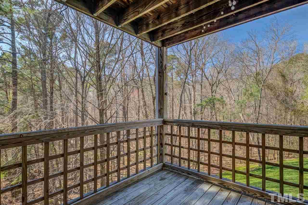 4641 Timbermill Court, Unit 201 Raleigh, NC 27612 - Photo 29 of 30 2nd covered deck off the master w/wooded views!