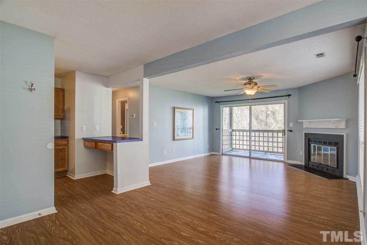 4641 Timbermill Court, Unit 201 Raleigh, NC 27612 - Photo 8 of 30 Sunny living room with fireplace!