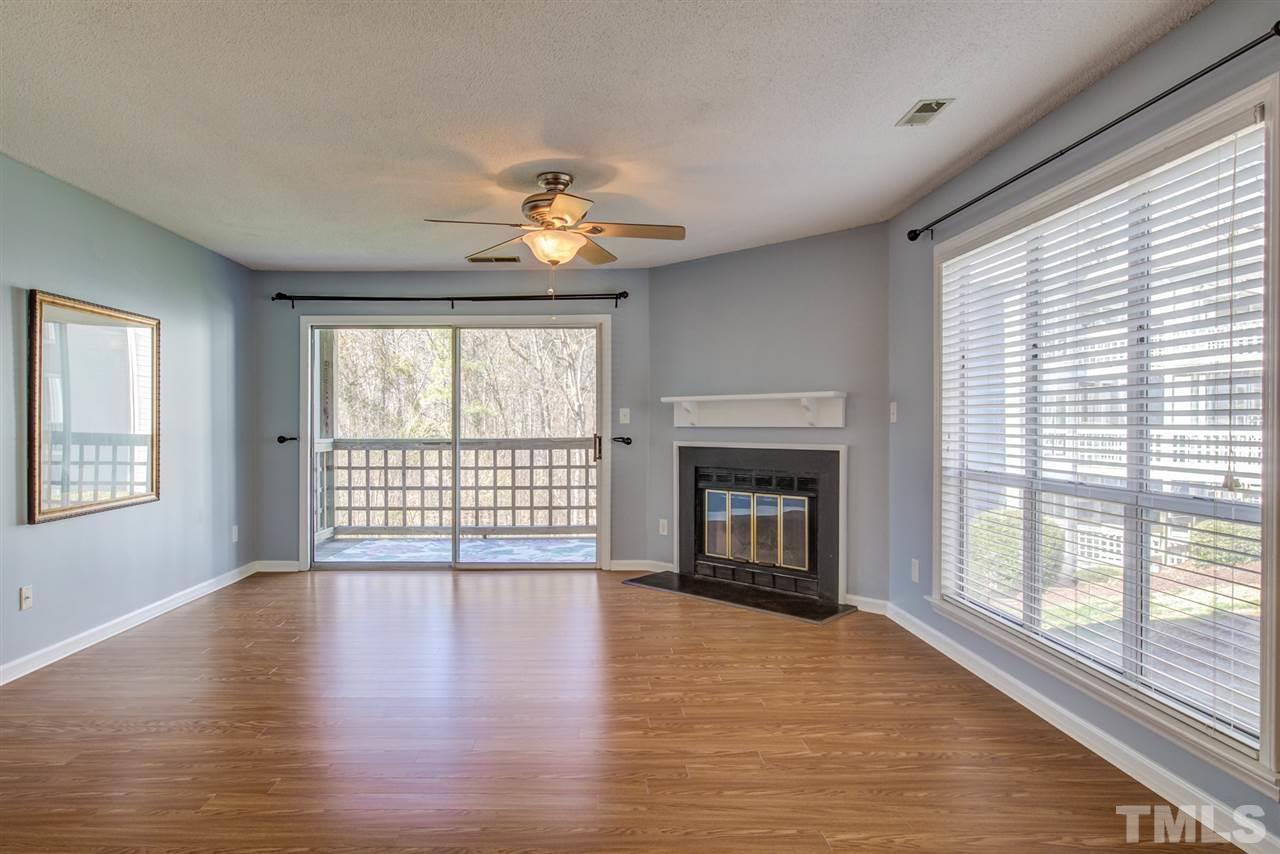 4641 Timbermill Court, Unit 201 Raleigh, NC 27612 - Photo 10 of 30 Wood burning fireplace in living room