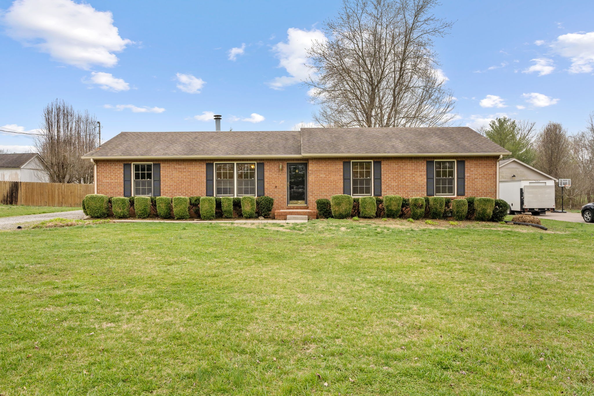 a front view of house with yard and outdoor seating