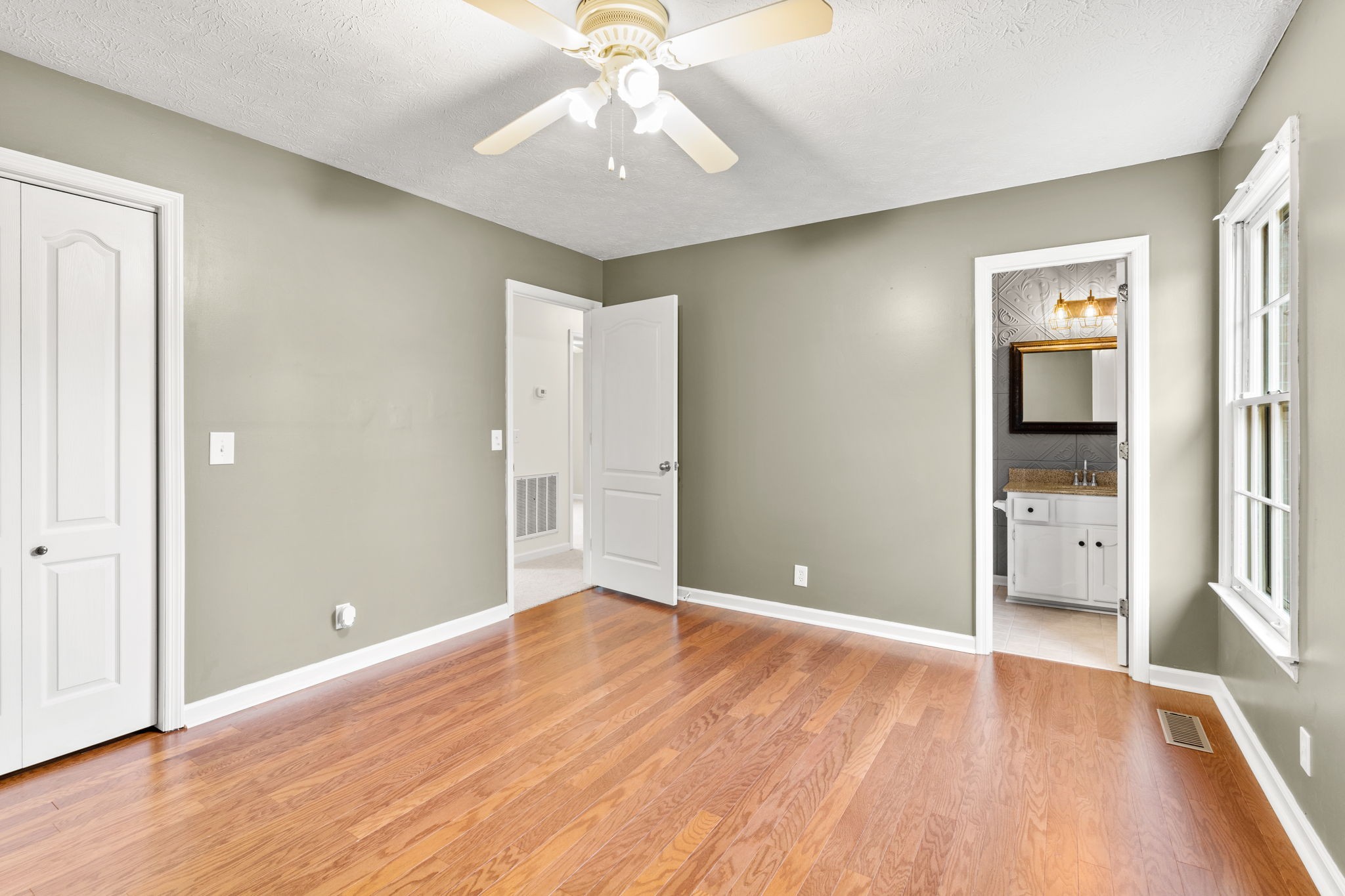 108 Meadows Road White House, TN 37188 - Photo 12 of 27 wooden floor in an empty room with a window
