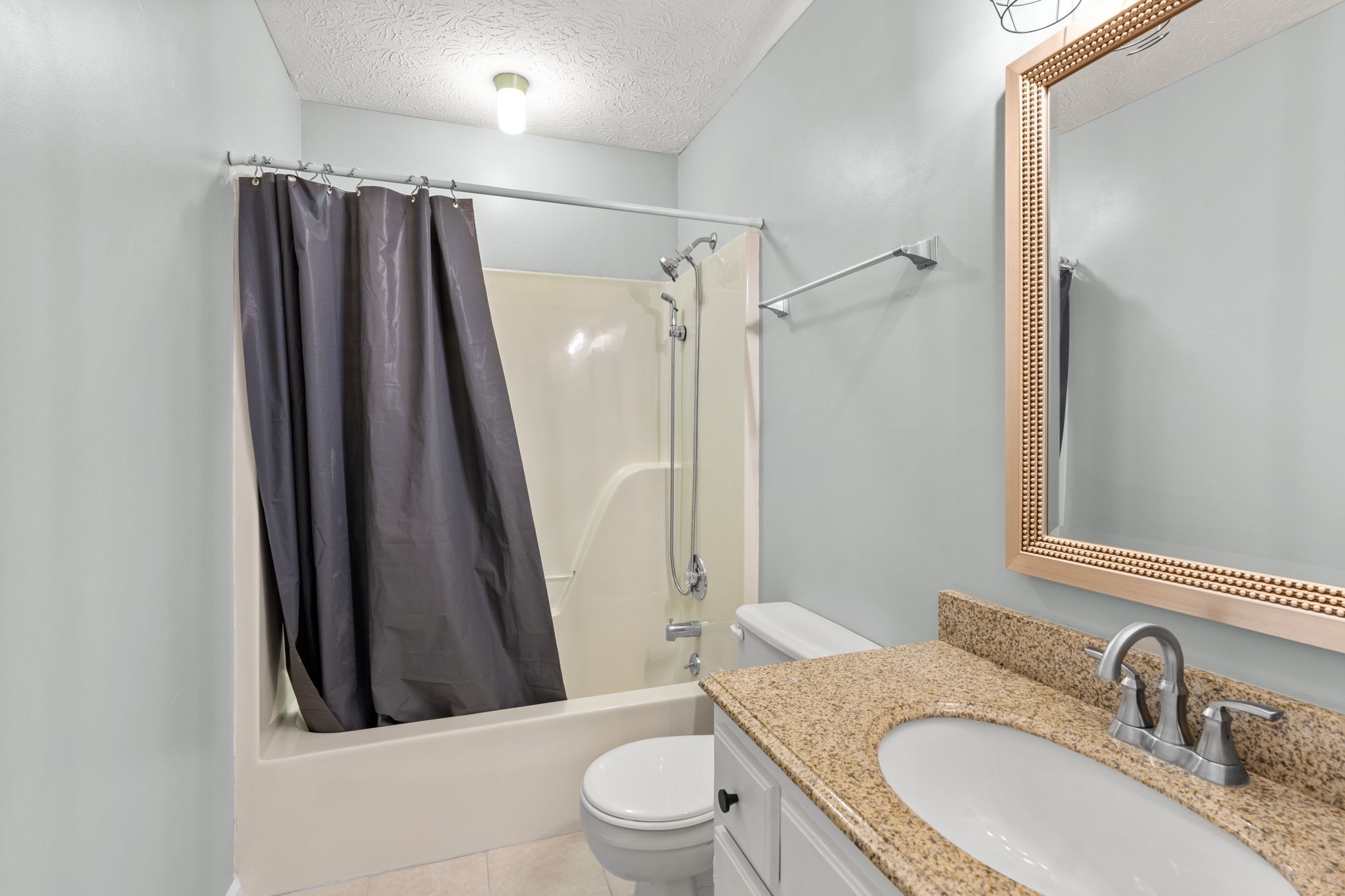 108 Meadows Road White House, TN 37188 - Photo 14 of 27 a bathroom with a granite countertop sink toilet and shower