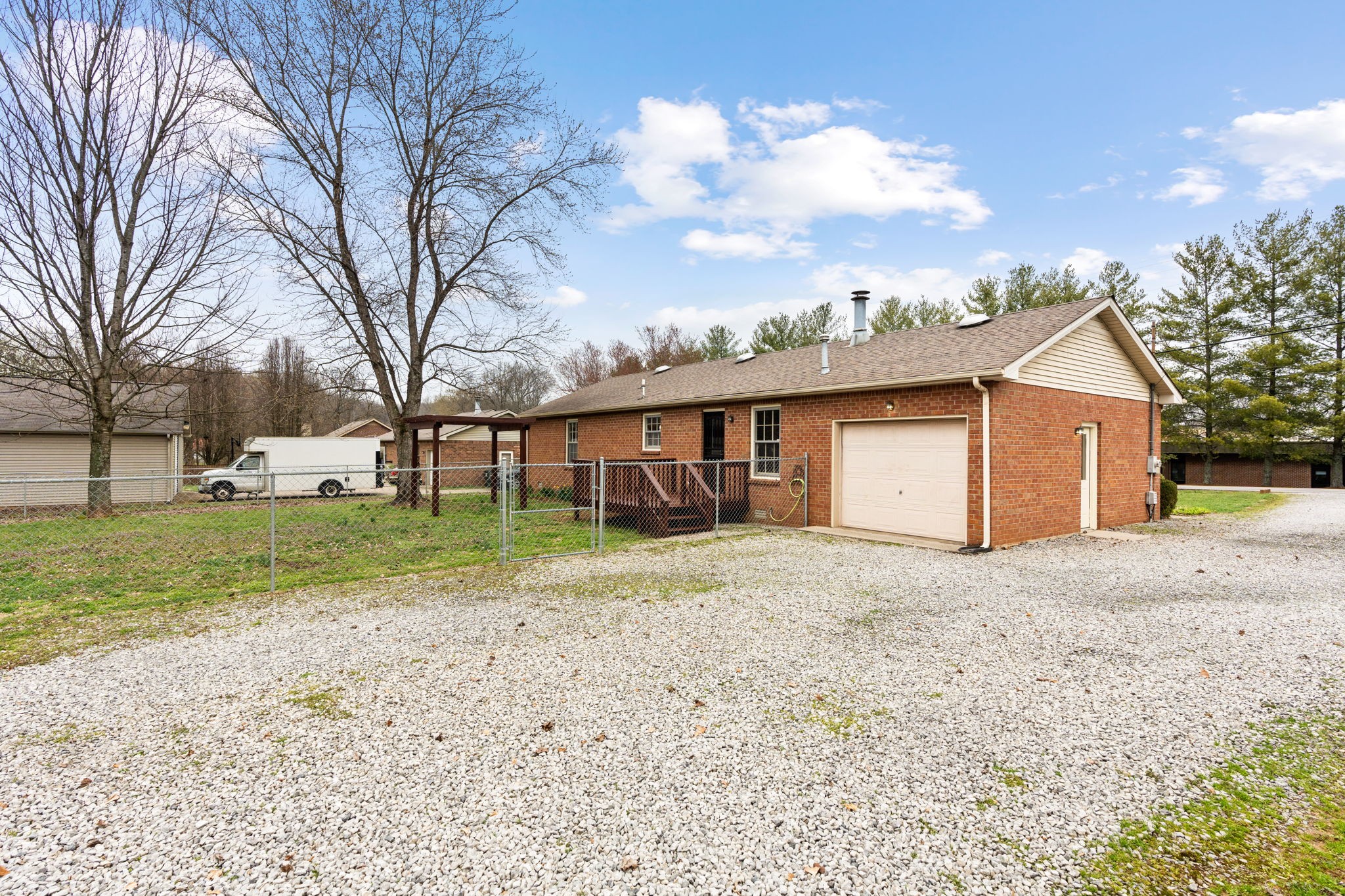 108 Meadows Road White House, TN 37188 - Photo 23 of 27 a front view of a house with a yard and garage