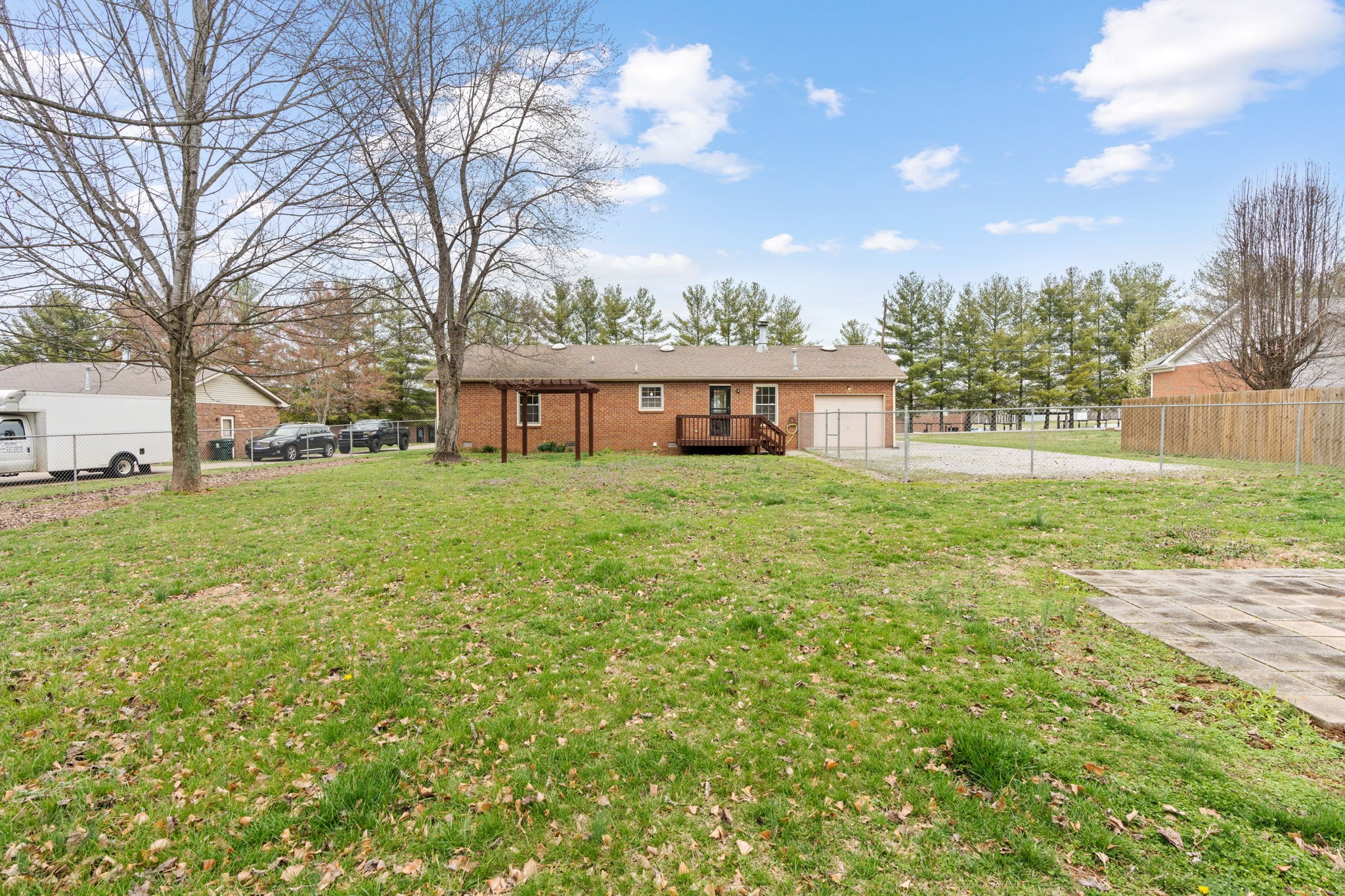 108 Meadows Road White House, TN 37188 - Photo 25 of 27 a view of a house with a big yard and large trees