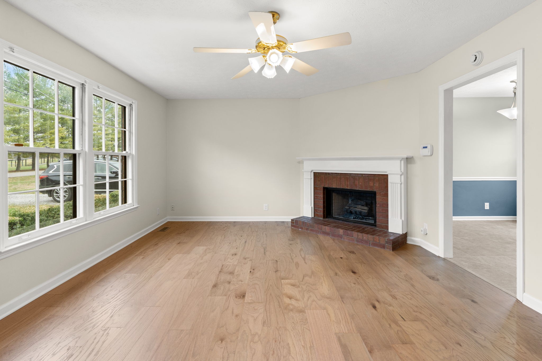 108 Meadows Road White House, TN 37188 - Photo 4 of 27 a view of an empty room with window and fire place