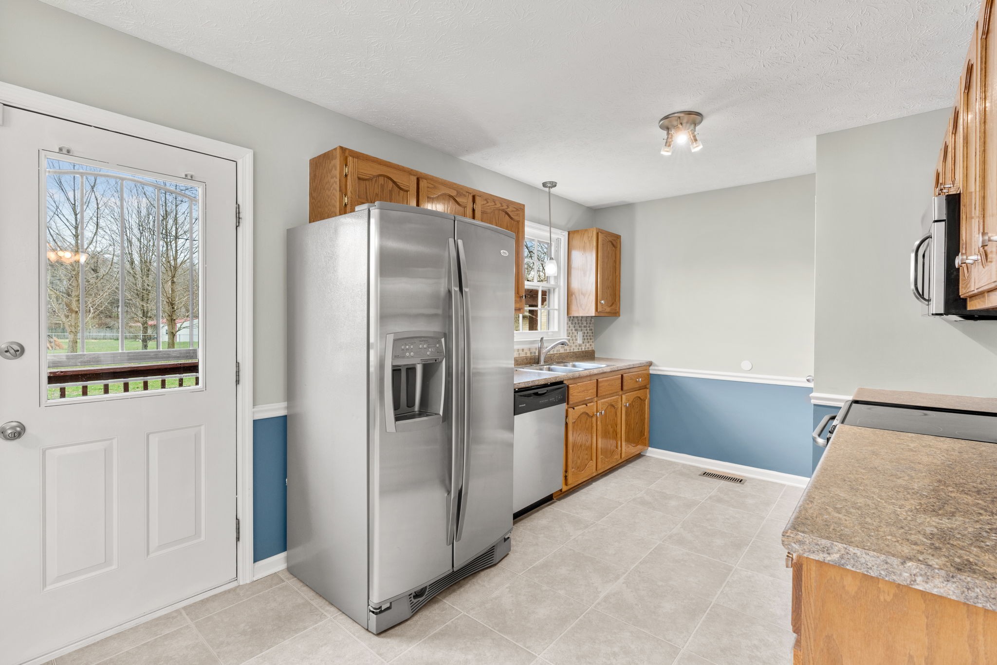 108 Meadows Road White House, TN 37188 - Photo 8 of 27 a kitchen with stainless steel appliances granite countertop a refrigerator and a sink