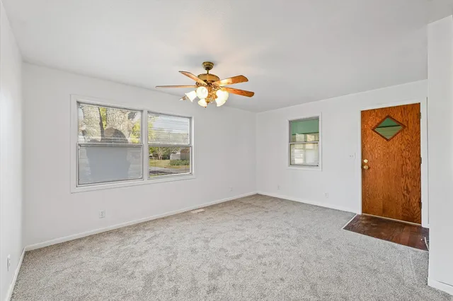 a view of an empty room with a window