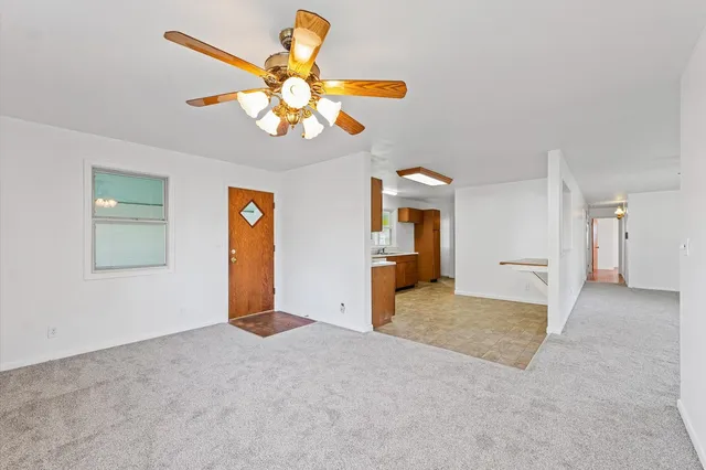 a view of a livingroom with a chandelier furniture and a chandelier