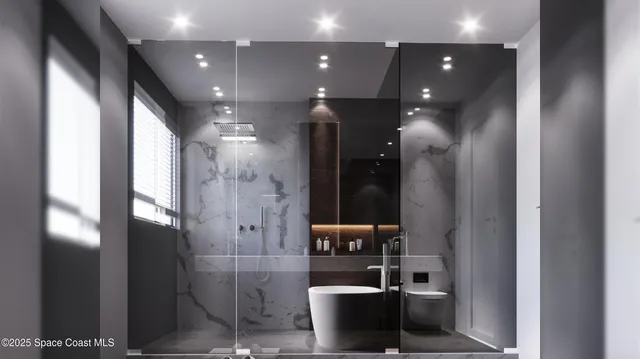 a bathroom with a glass shower door