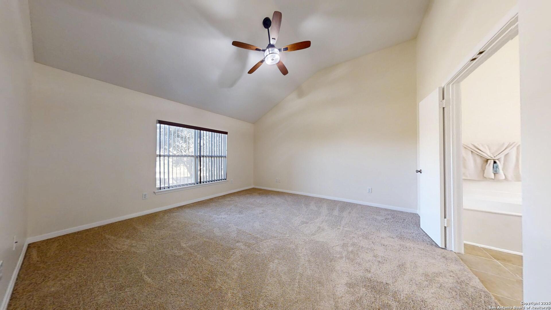 10718 Mustang Ridge Converse, TX 78109 - Photo 12 of 21 a view of an empty room with a window