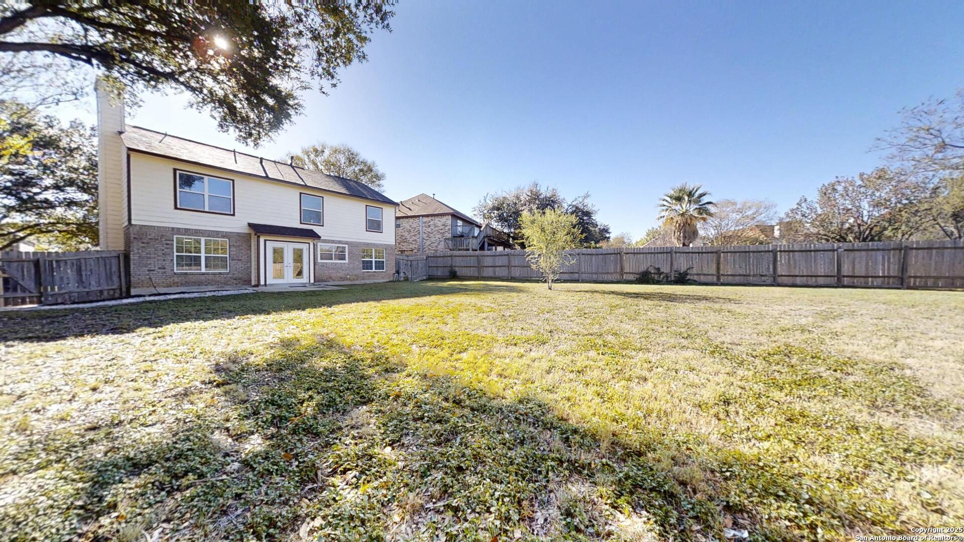 10718 Mustang Ridge Converse, TX 78109 - Photo 21 of 21 a view of a house with a yard
