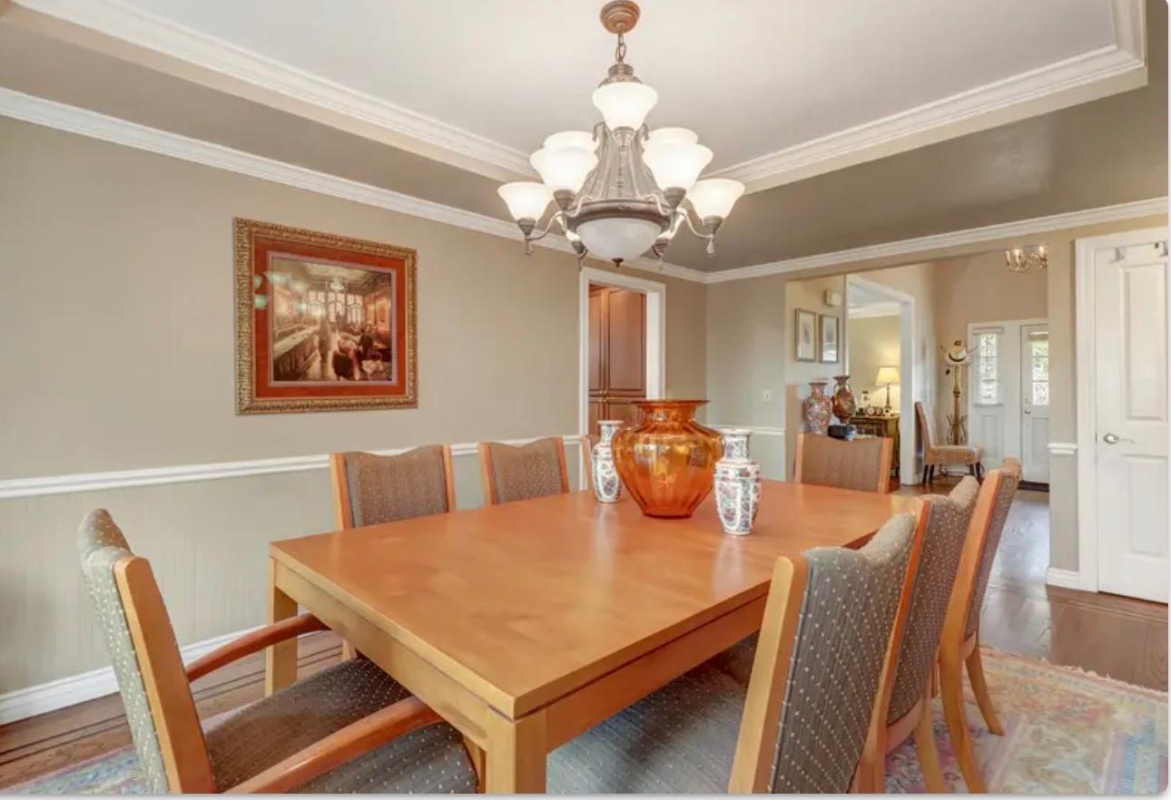 15044 Rio Circle Rancho Murieta, CA 95683 - Photo 14 of 50 a view of a dining room with furniture and chandelier