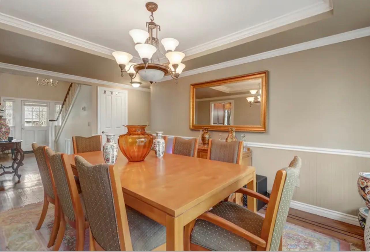 15044 Rio Circle Rancho Murieta, CA 95683 - Photo 15 of 50 a view of a dining room with furniture a chandelier and wooden floor