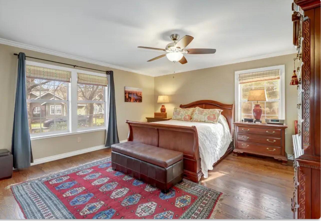 15044 Rio Circle Rancho Murieta, CA 95683 - Photo 22 of 50 a bedroom with a bed wooden floor and a table