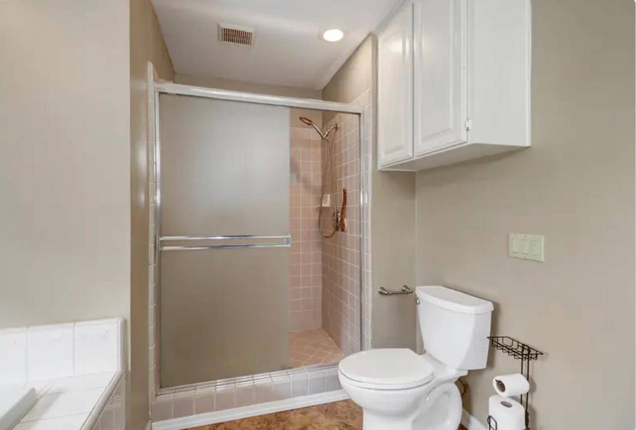 15044 Rio Circle Rancho Murieta, CA 95683 - Photo 27 of 50 a white toilet sitting next to a bathroom sink