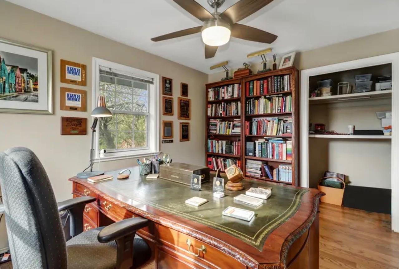15044 Rio Circle Rancho Murieta, CA 95683 - Photo 30 of 50 a view of a workspace with furniture and a bookshelf