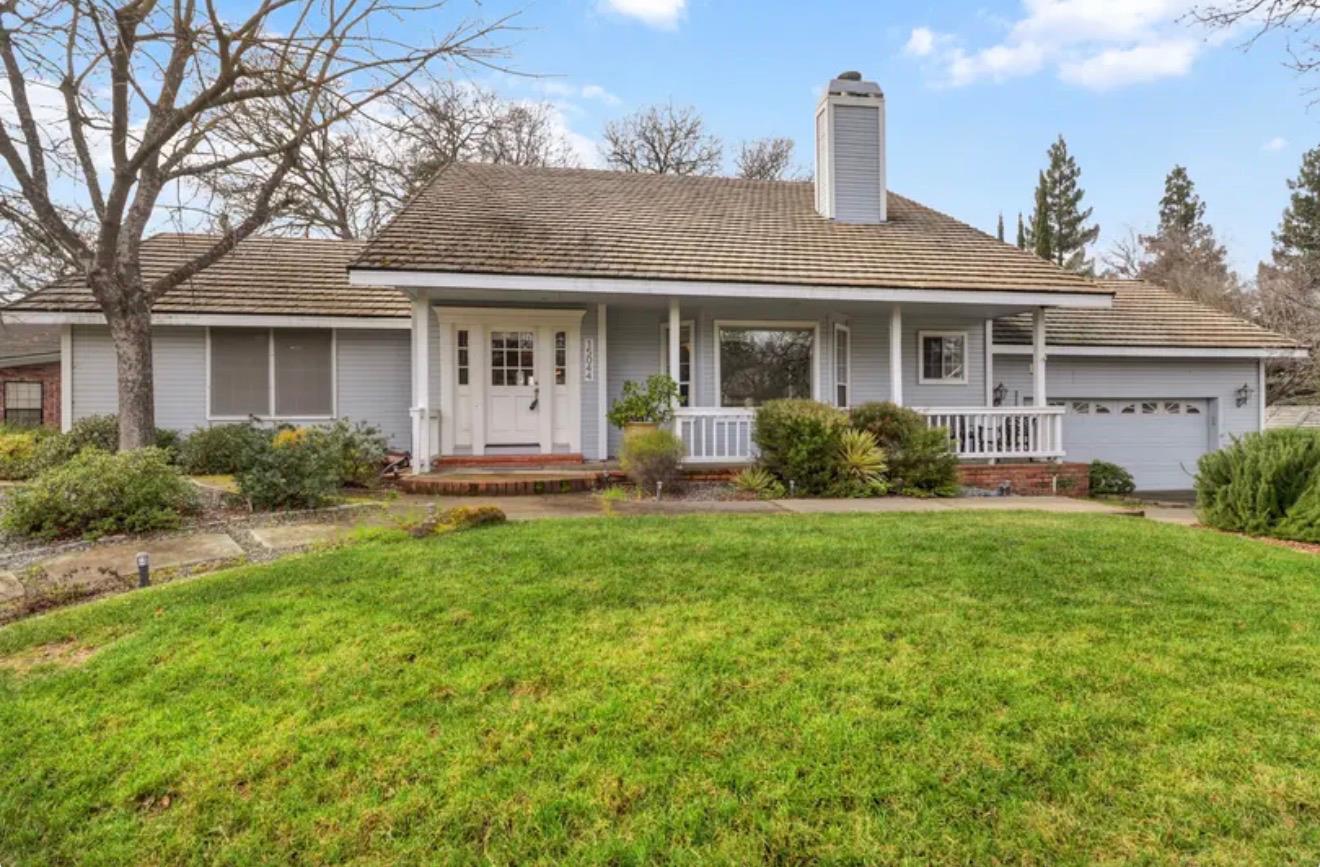 15044 Rio Circle Rancho Murieta, CA 95683 - Photo 3 of 50 a front view of a house with yard and green space