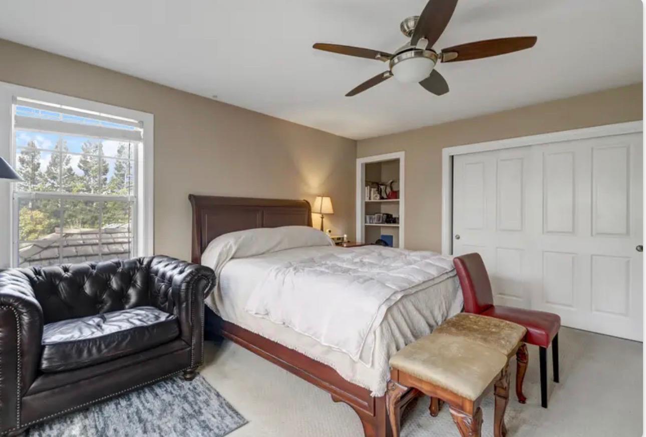 15044 Rio Circle Rancho Murieta, CA 95683 - Photo 32 of 50 a bedroom with a bed couch and window