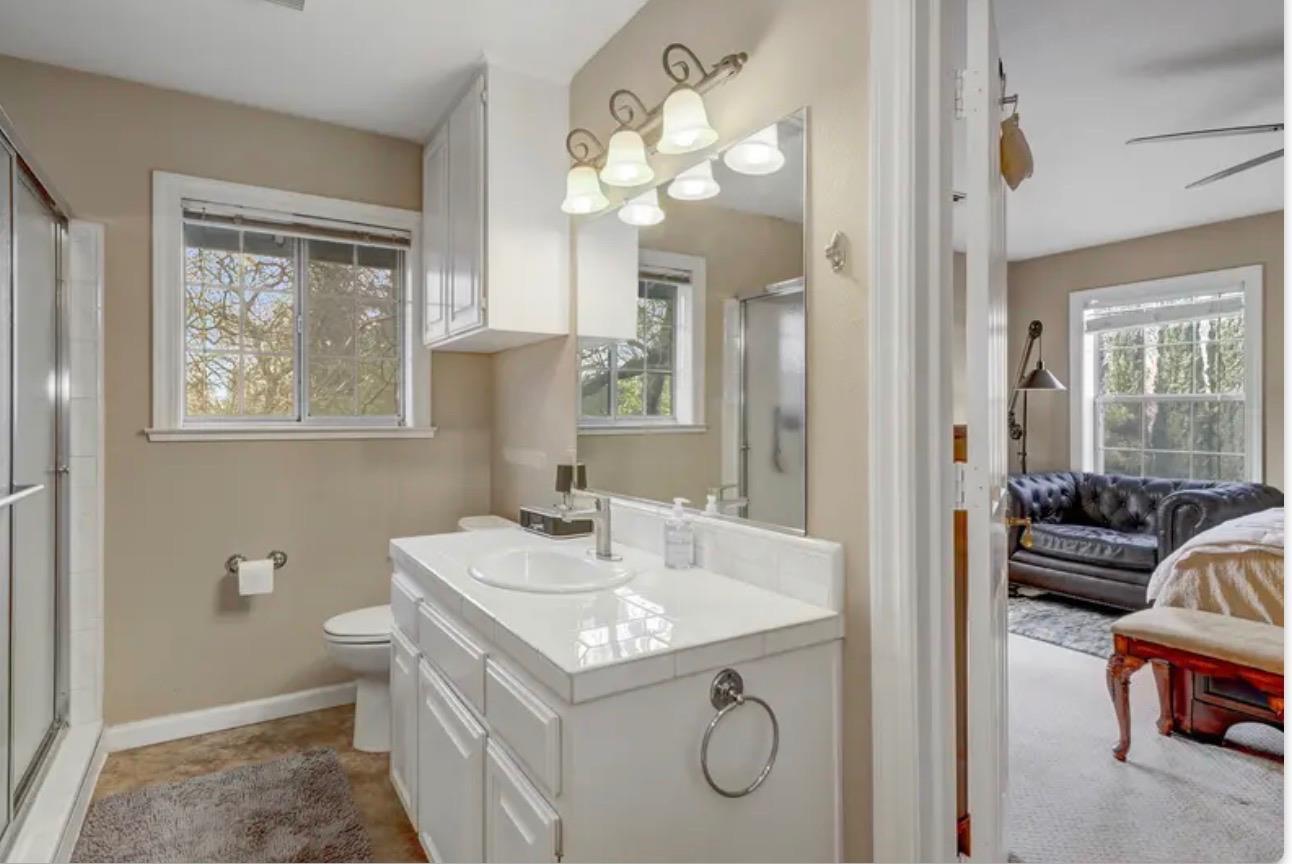 15044 Rio Circle Rancho Murieta, CA 95683 - Photo 34 of 50 a bathroom with a sink double vanity and a mirror