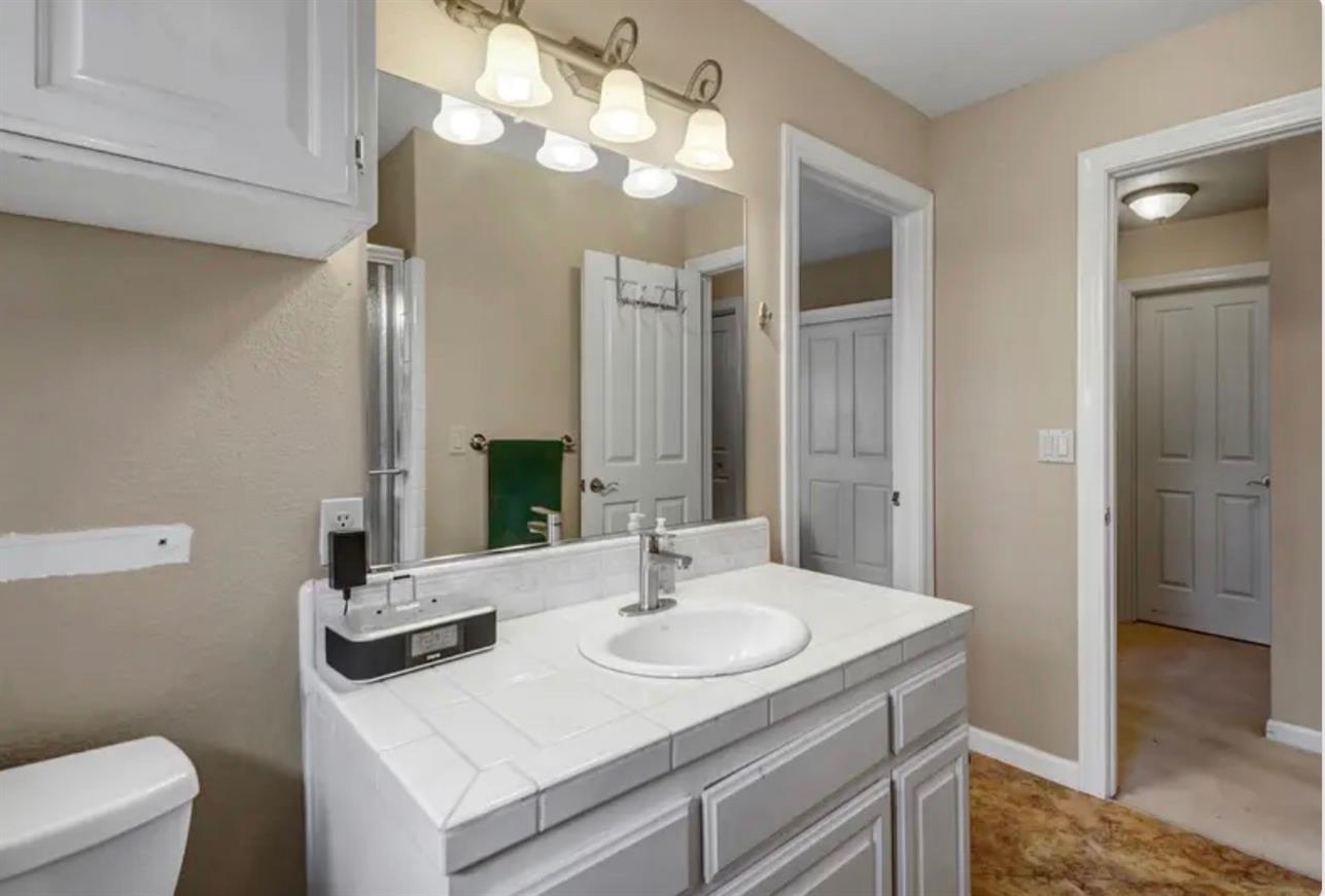 15044 Rio Circle Rancho Murieta, CA 95683 - Photo 36 of 50 a bathroom with a sink and a mirror
