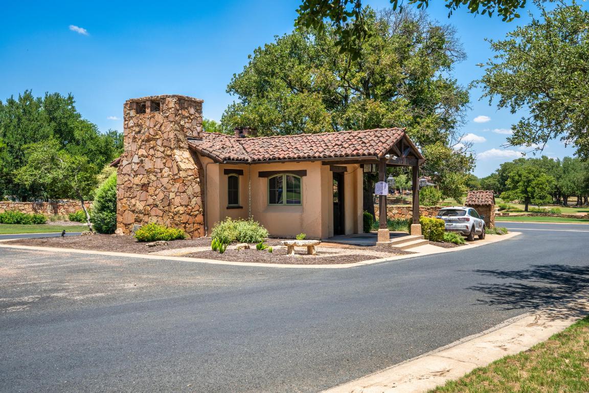 100 Sunny Bell Court Georgetown, TX 78628 - Photo 12 of 16 a front view of a house with a garden