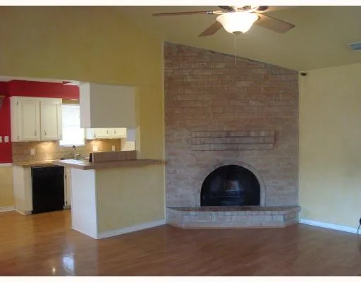 a living room with granite countertop furniture and a fireplace