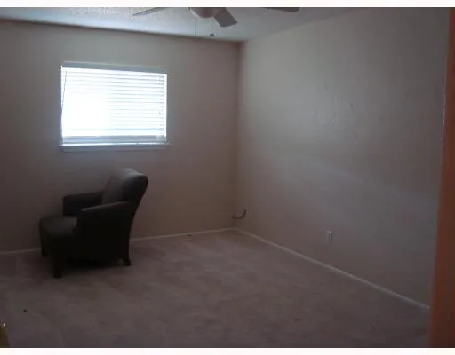 a room with a chair and a window