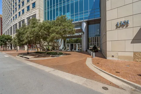 a living room with fireplace furniture and a chandelier