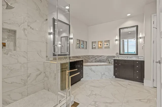 a bathroom with a granite countertop double vanity sink a mirror and a