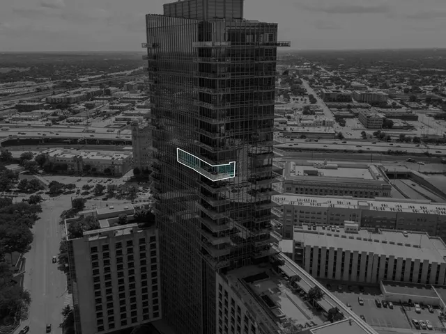 front view of a building with potted plants