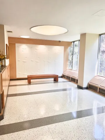 a view of a living room with a large window
