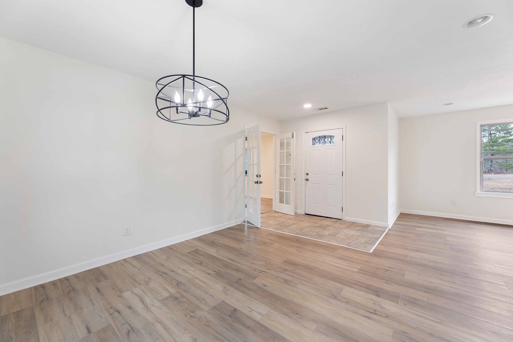 322 Moores Chapel Road Mauk, GA 31058 - Photo 13 of 34 a view of empty room with wooden floor and window