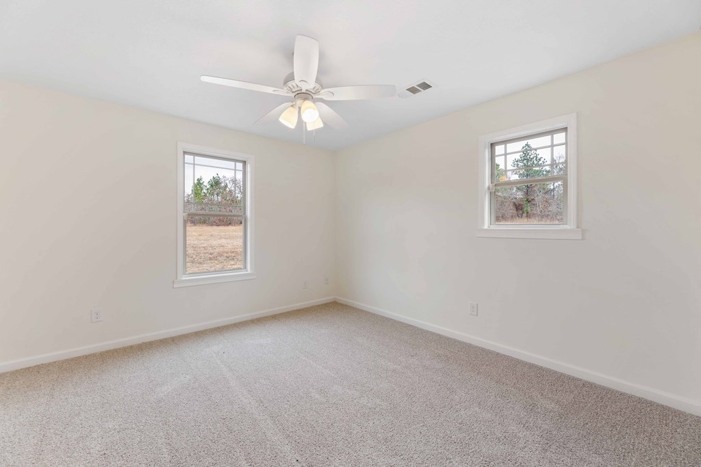 322 Moores Chapel Road Mauk, GA 31058 - Photo 19 of 34 an empty room with a window