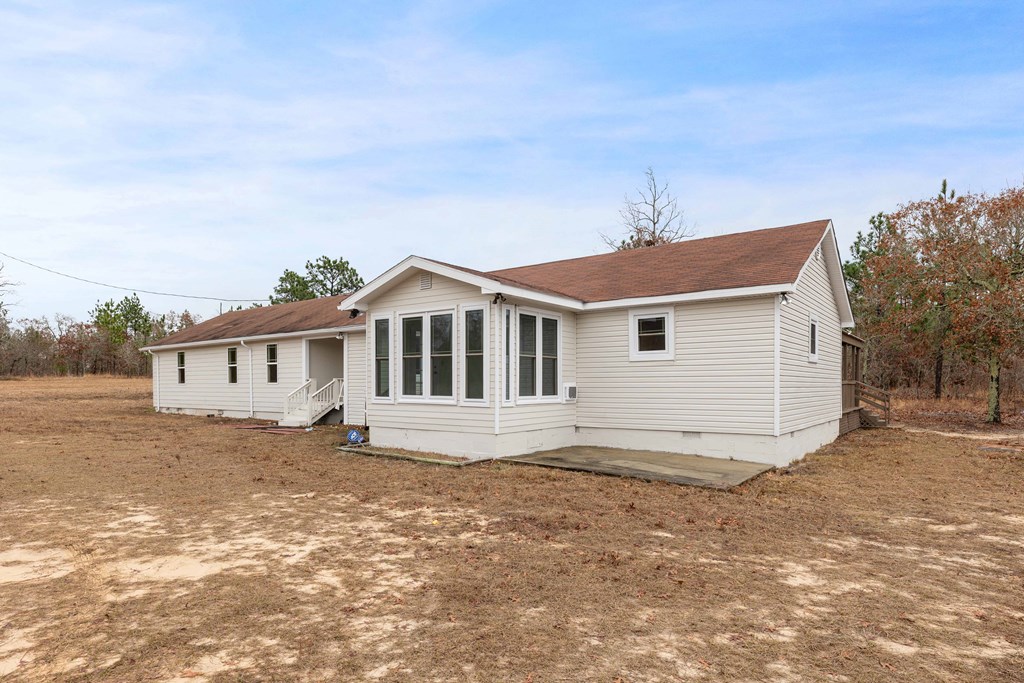 322 Moores Chapel Road Mauk, GA 31058 - Photo 34 of 34 a front view of a house with a yard